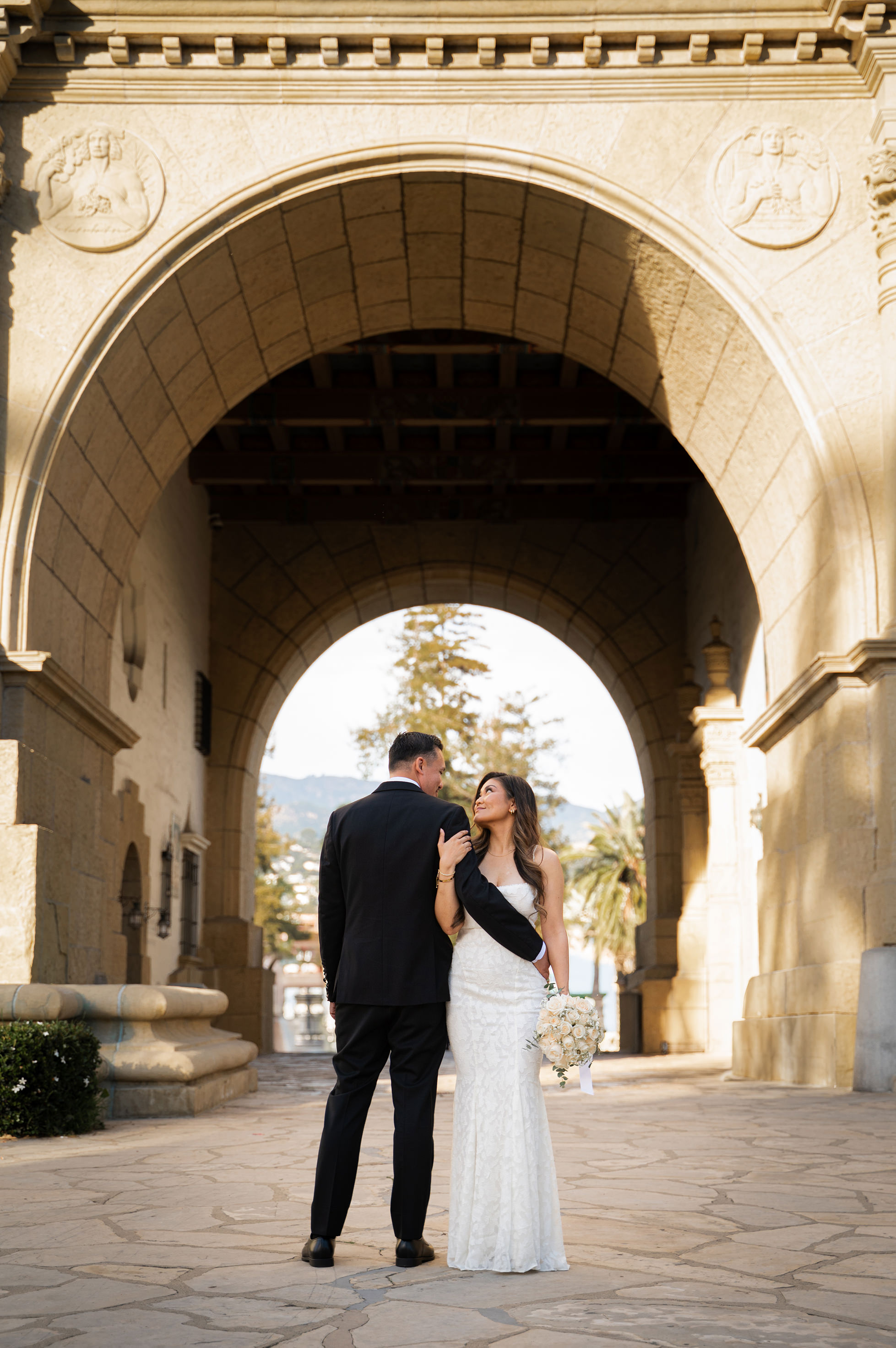 Romantic couple photo with Santa Barbara Courthouse arches in the background