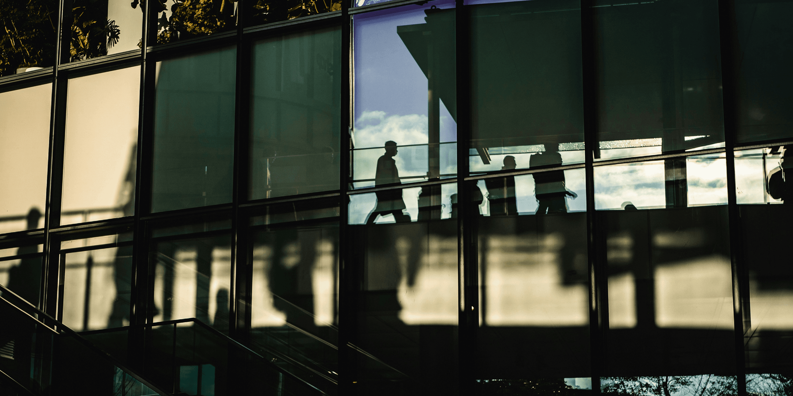Team having a casual strategy discussion in a bright office space, representing collaboration and problem-solving.