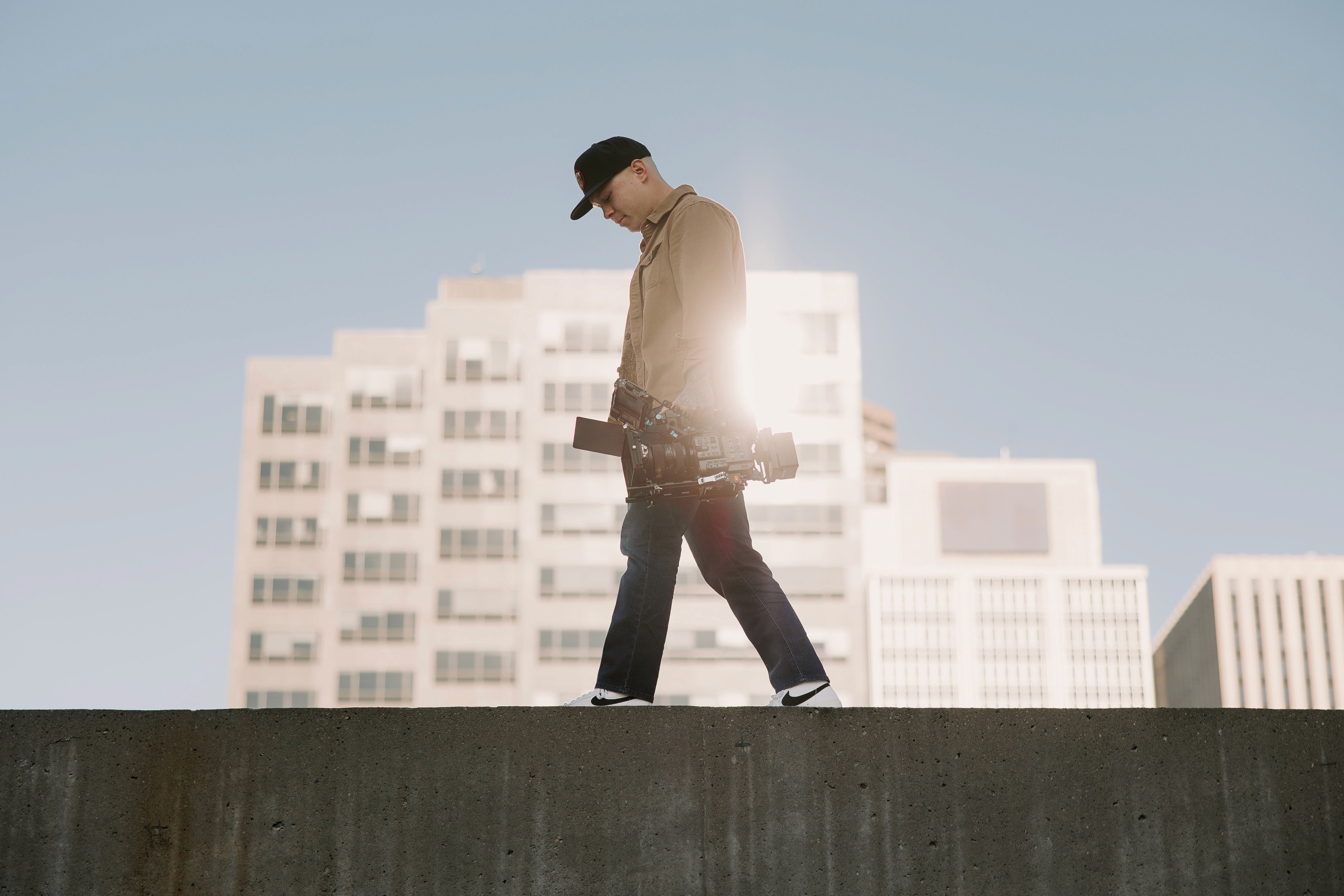 Jason Luong walking with a Sony FX6