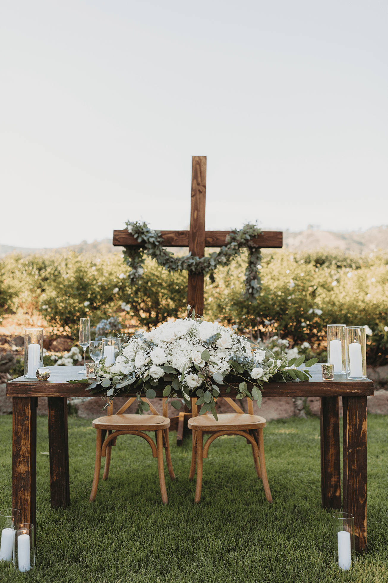 Flat lay wedding details with bouquet, rings, and sparkling bridal heels