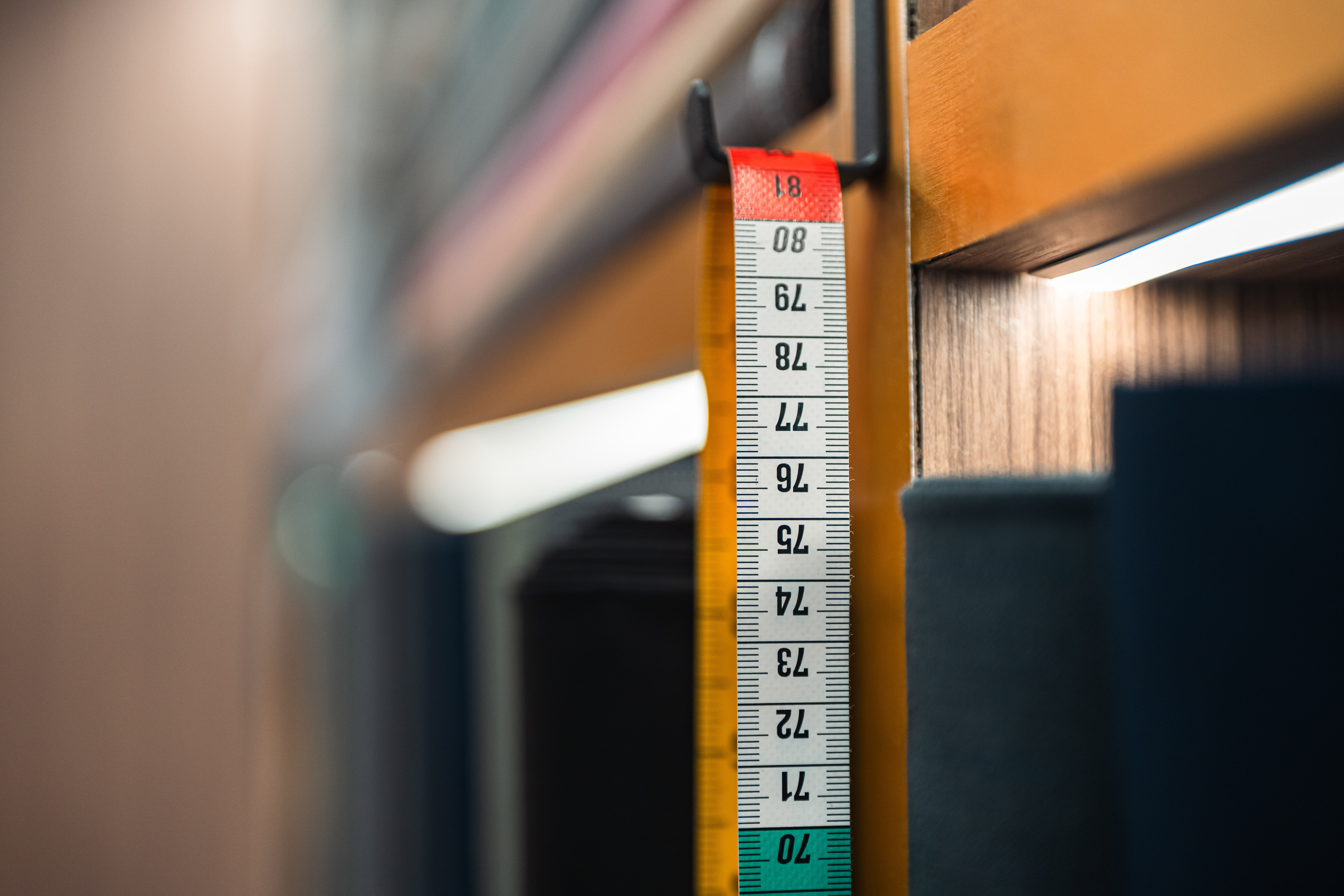 Old workshop with wooden table and shelves full of items