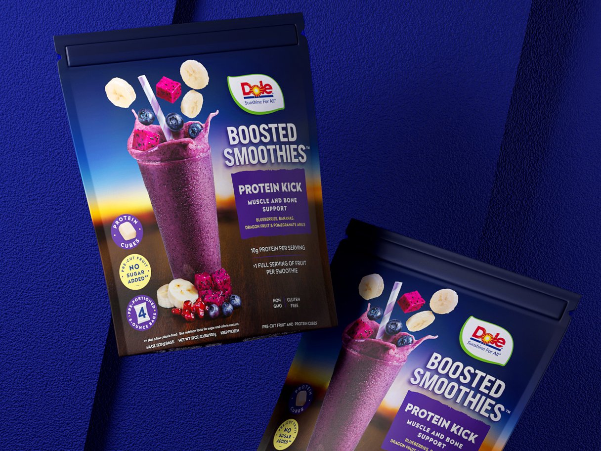 Rooftops of a coastal town with the sea in background