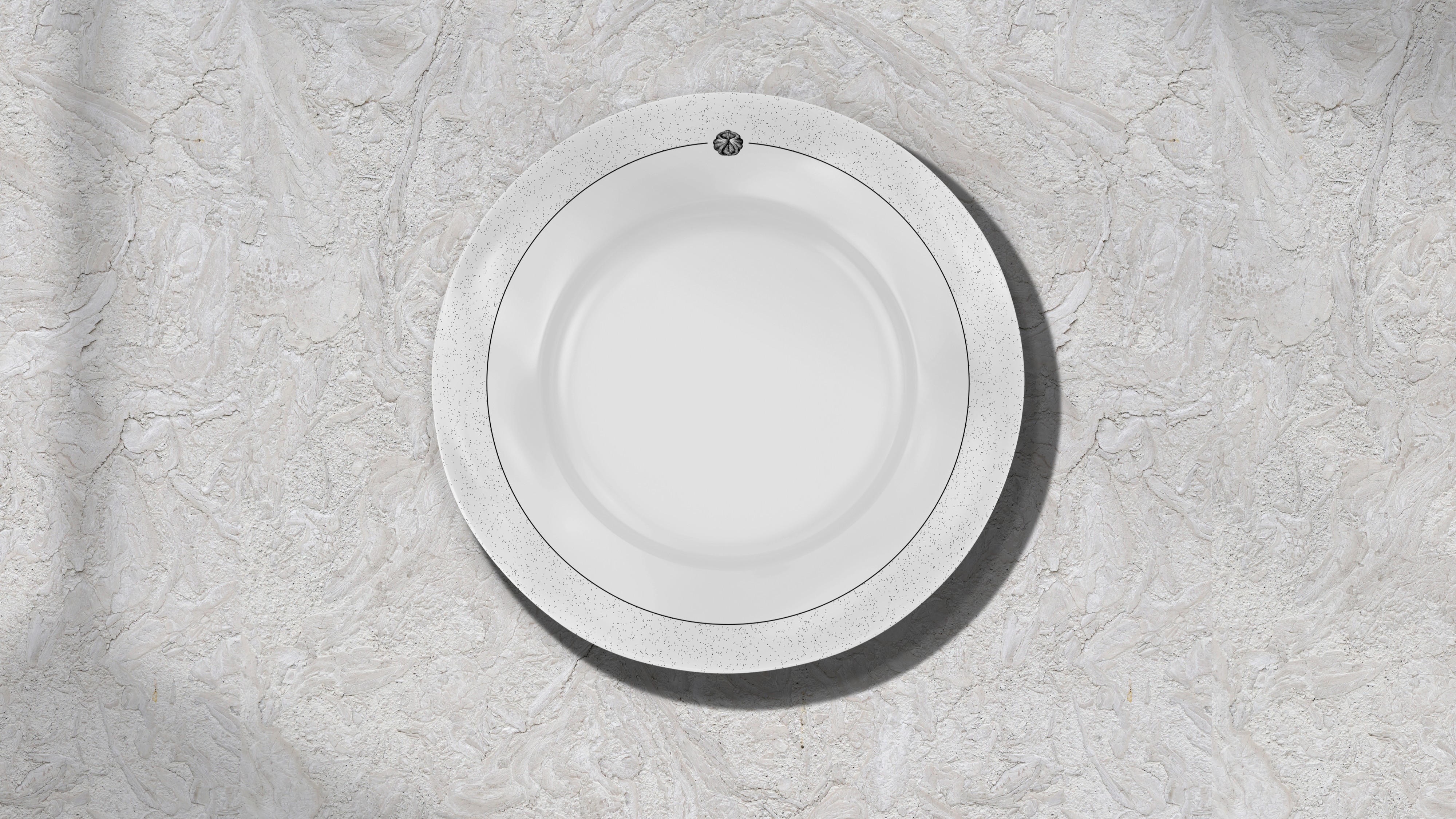 Shiny metallic silver foil pouch lying flat, printed with a large black outline of a smiley face, all set against a bright orange backdrop.