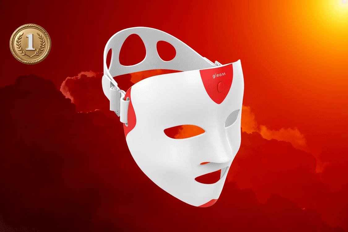 man filming on beach