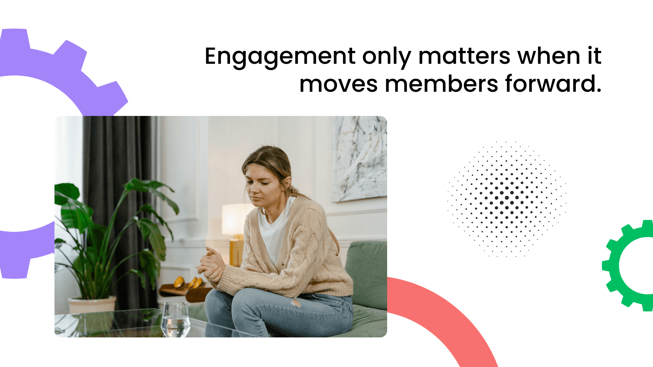 Woman sitting on a sofa near a plant, holding a cup and looking thoughtfully ahead.