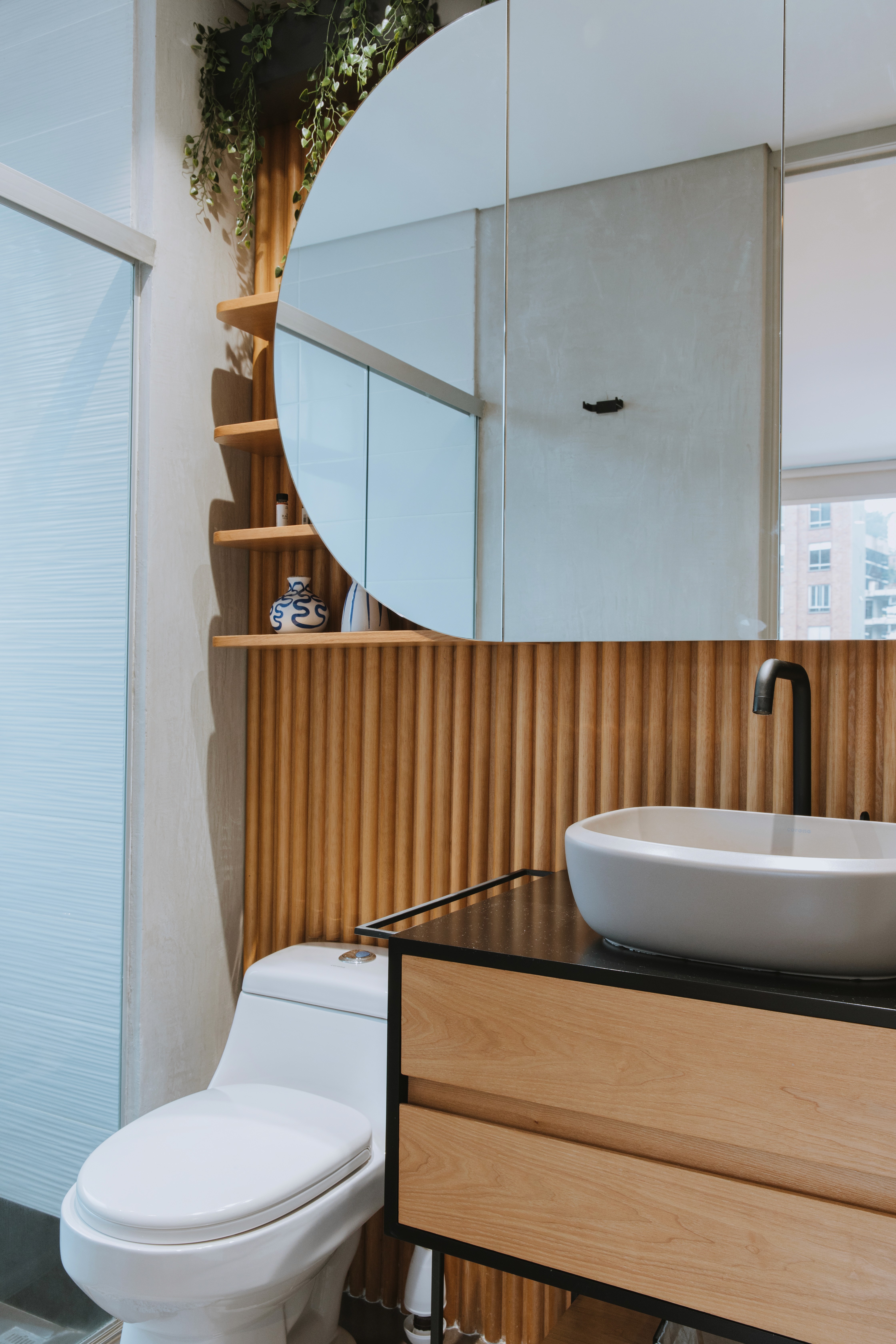 Double-height interior with flowing sculptural forms and warm raking light