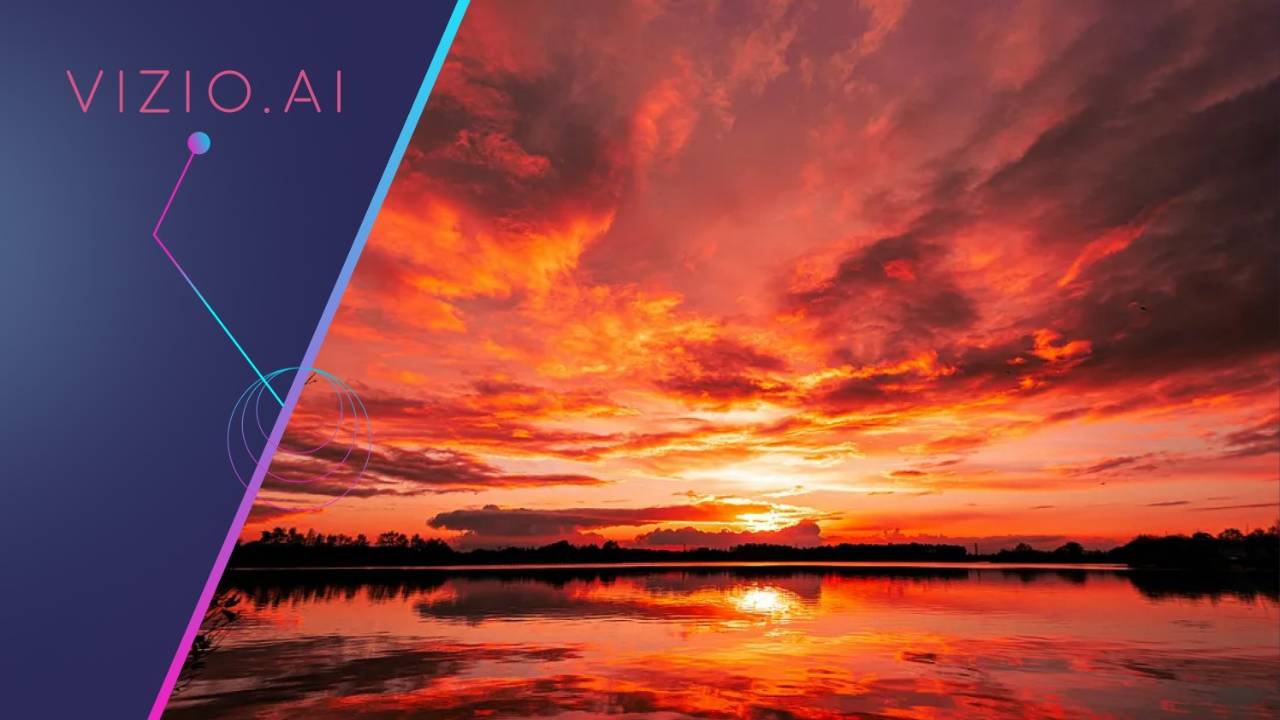 Fiery red sunset reflected across a still lake.
