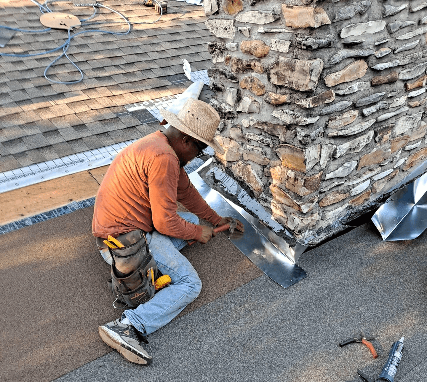 Fixing the flashing on a chimeny flat roof. 