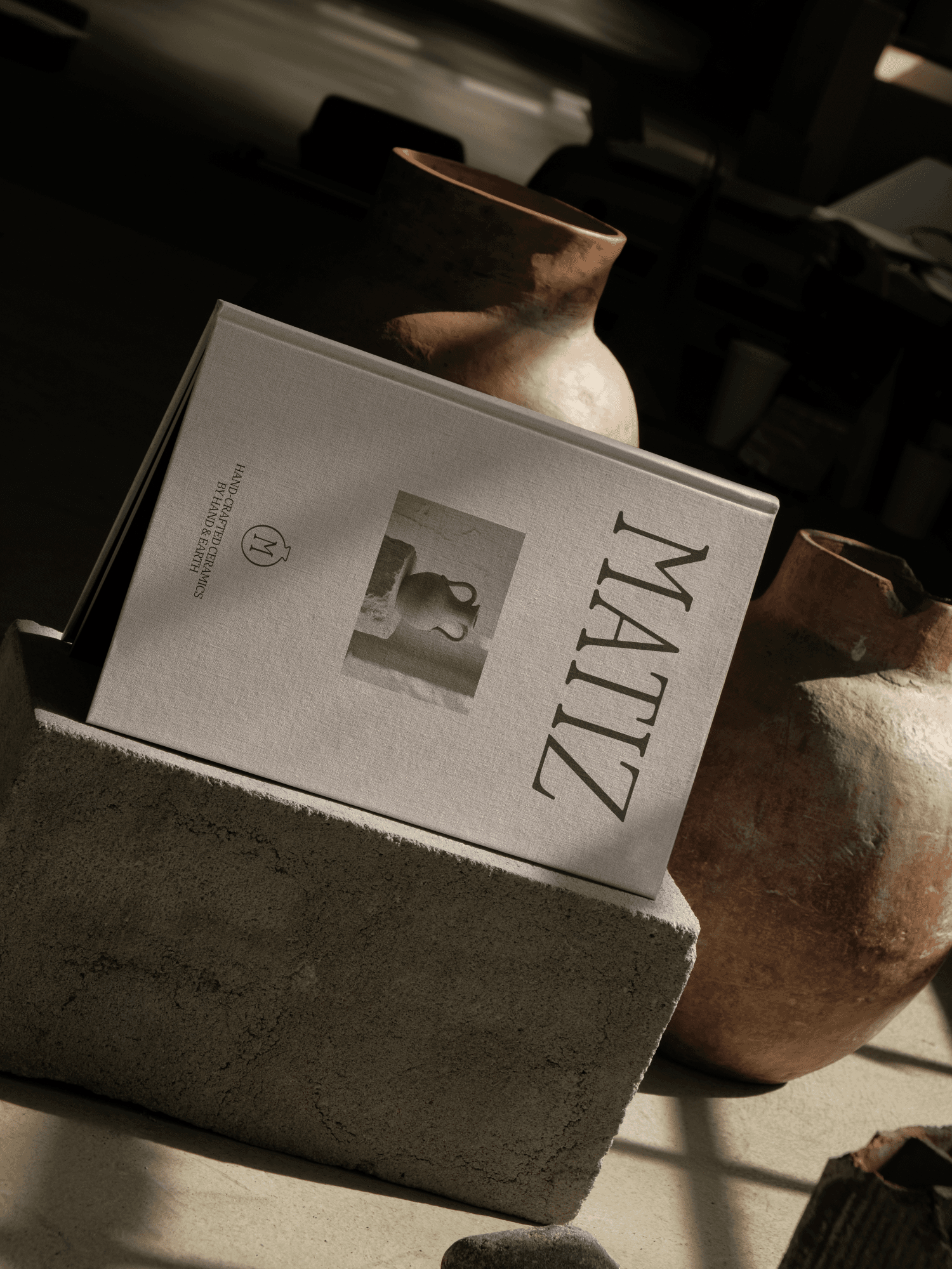 A book with the brand name MATIZ and a photo of a ceramic pot on the cover.