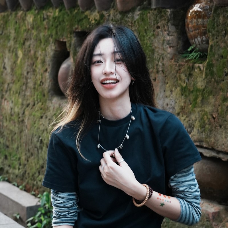 A portrait of Jialai Chen, a student from China, Class of 2027, displaying a friendly smile and casual attire, with a background that suggests a vibrant academic environment.
