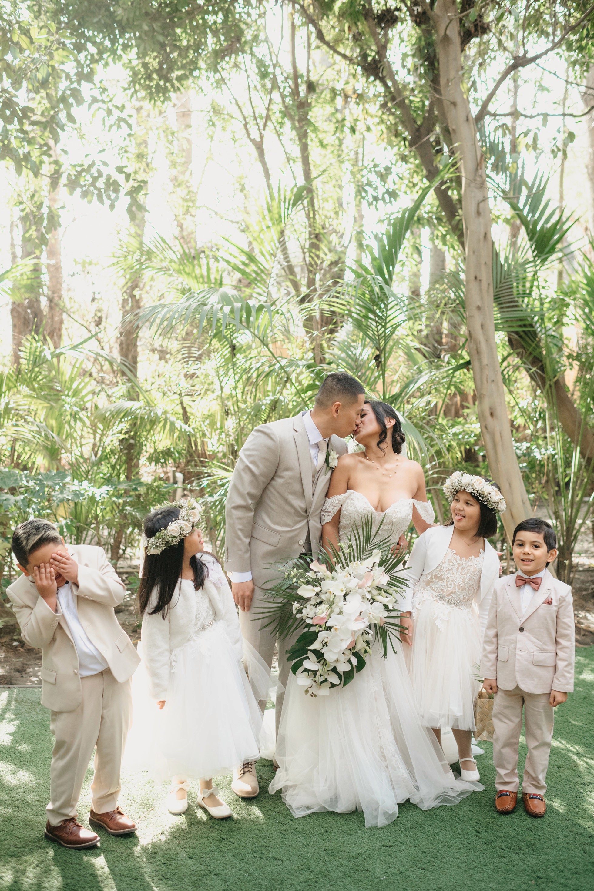 Flat lay wedding details with bouquet, rings, and sparkling bridal heels