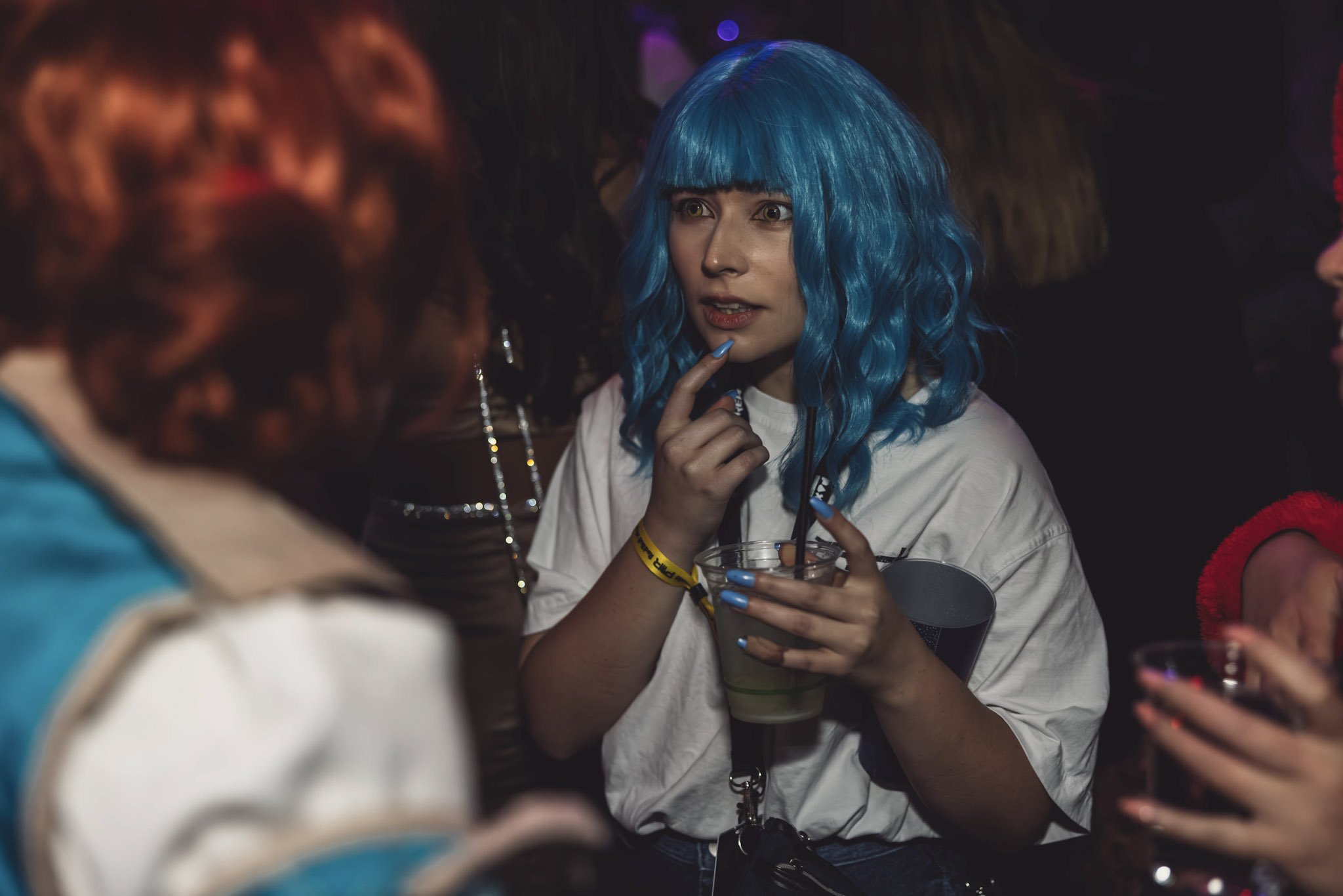 A person holding a drink at Fortress