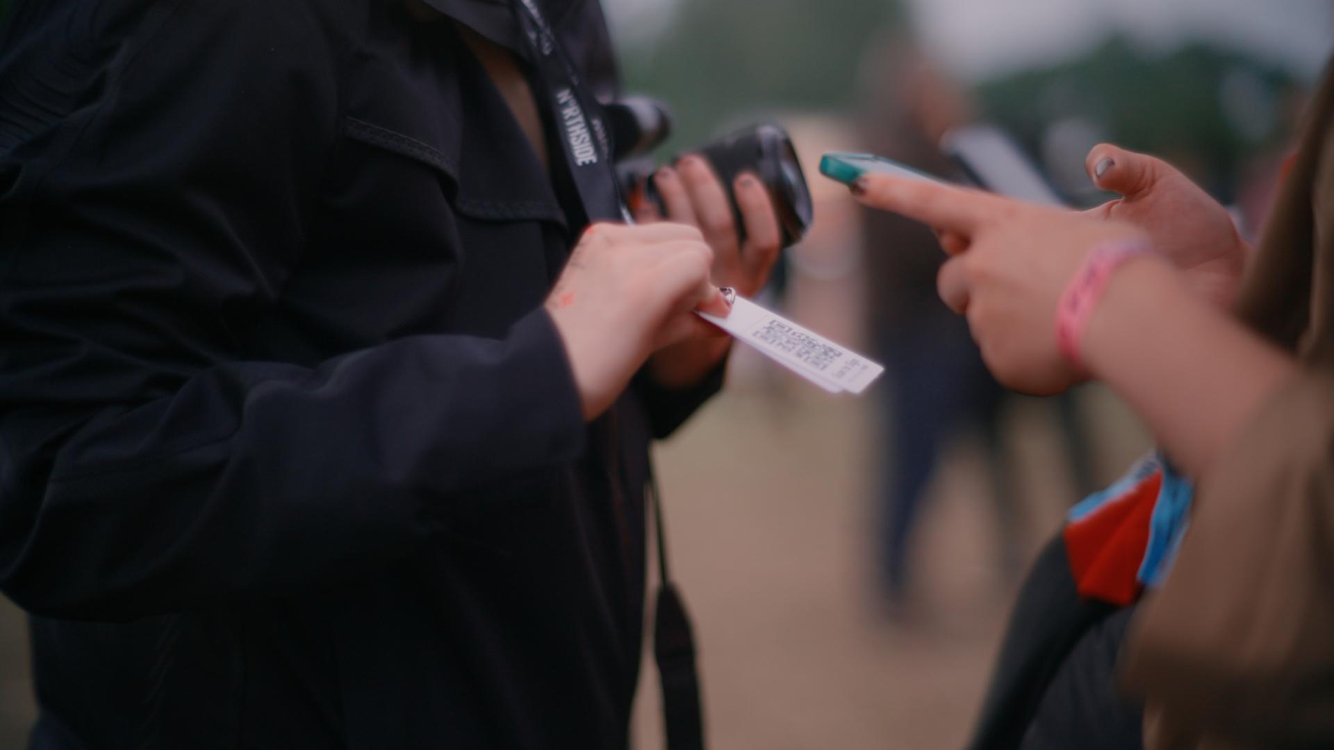 Photographer collecting consents at event