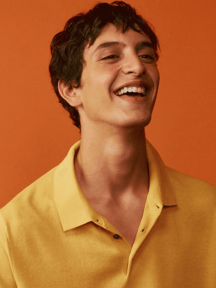 a man wearing glasses and a black shirt