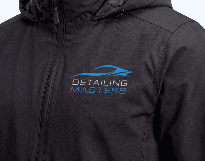 Detailing Masters logo on the chest area of a windbreaker style jacket worn by a male model
