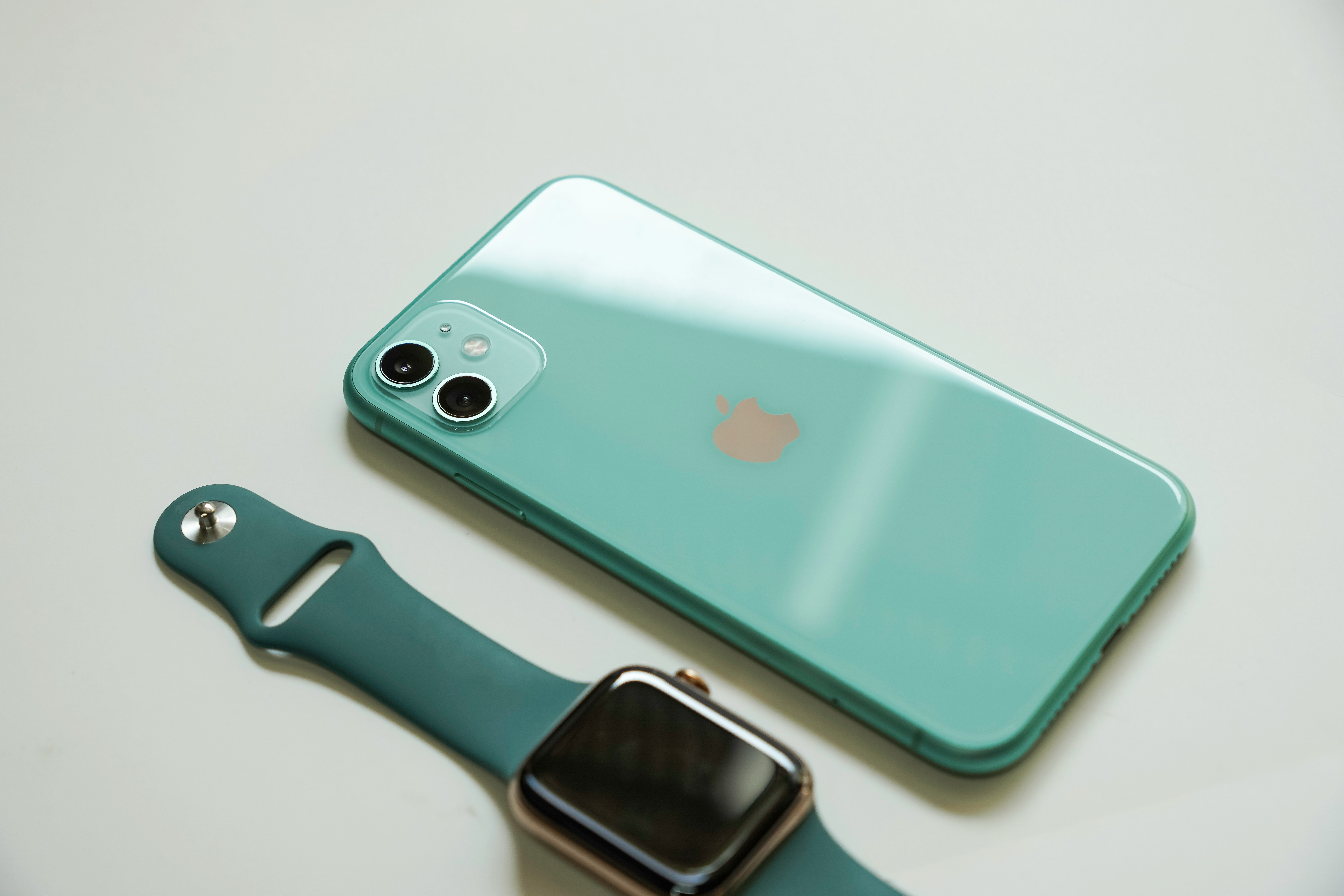 silver iphone 6 with blue sport band apple watch