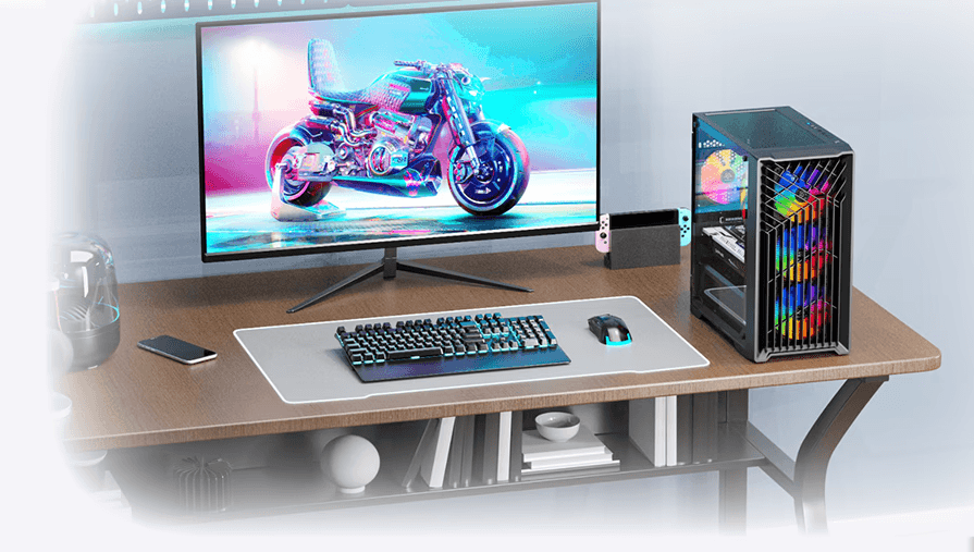 Modern gaming setup featuring a sleek gaming PC with vibrant RGB lighting, paired with a large monitor displaying a futuristic motorcycle game. The keyboard, mouse, and phone are neatly placed on a desk, adding to the high-tech aesthetic of the gaming environment.