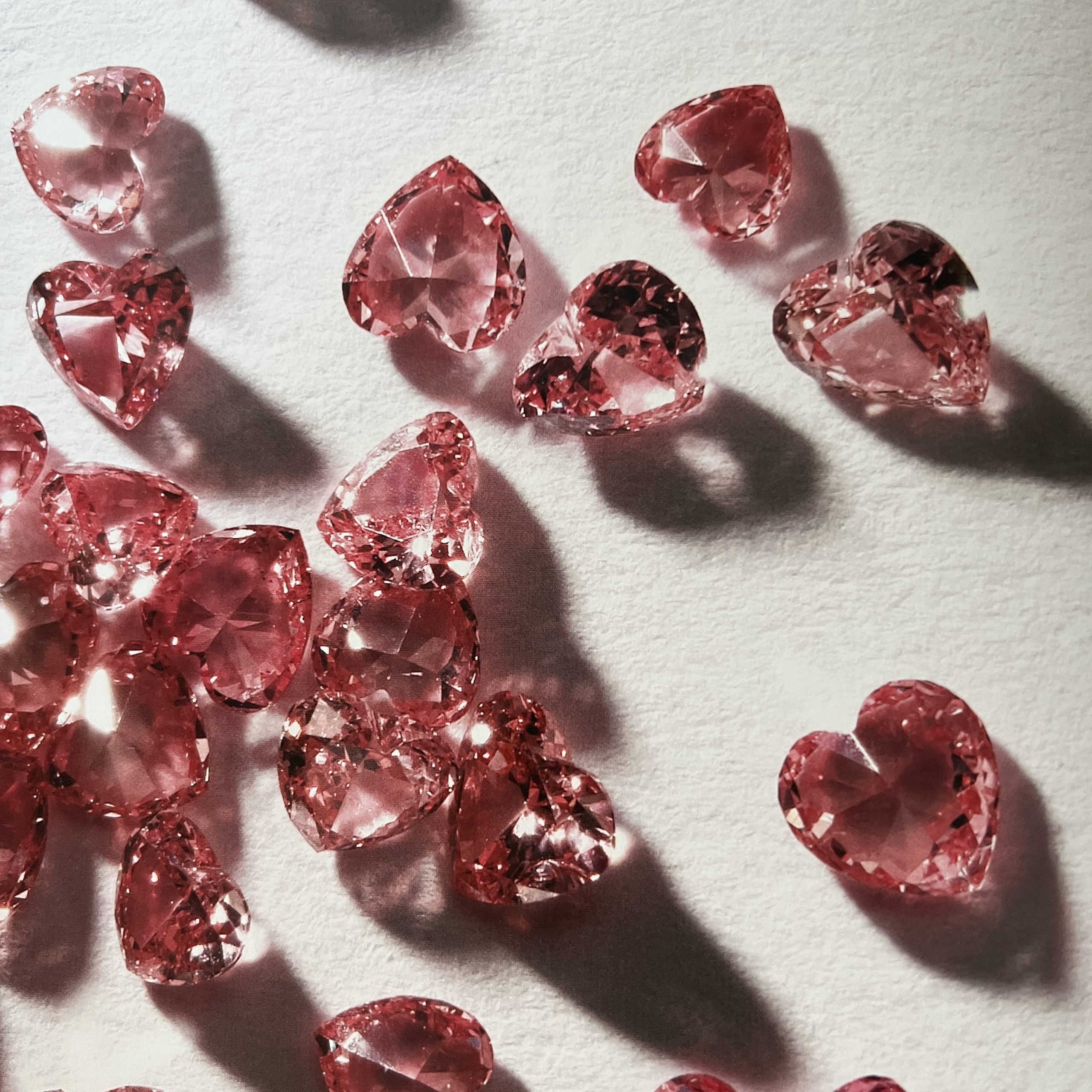 Group of loose rough pink diamonds, some gem-quality, referencing rarity and natural colour origins