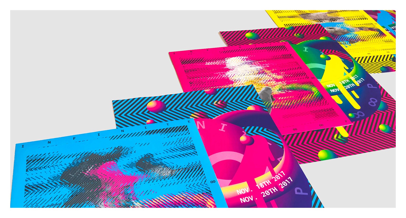 A set of blue, red, purple, magenta, yellow, green and crimson colored posters.