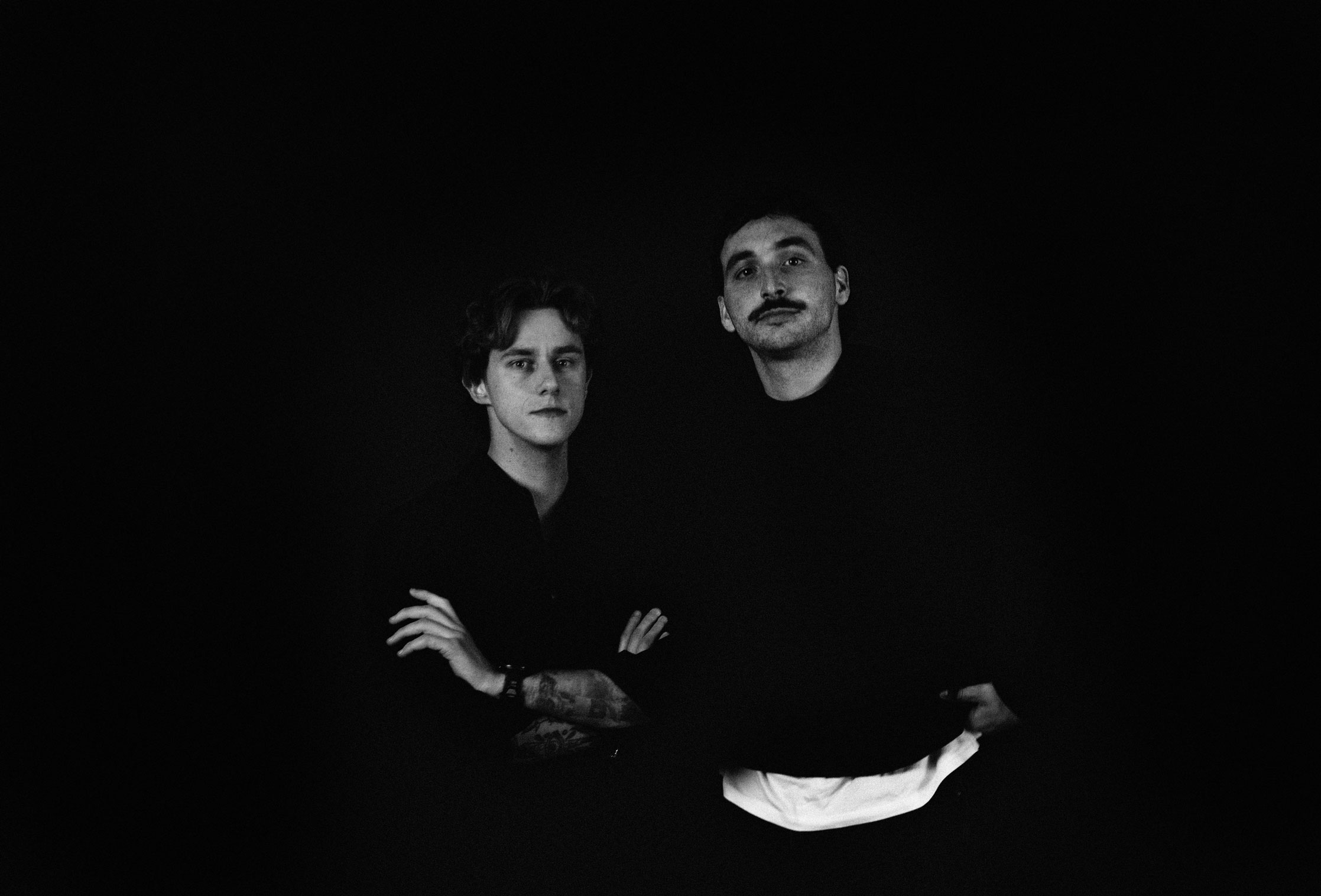 People celebrating, red stickers floating in the air