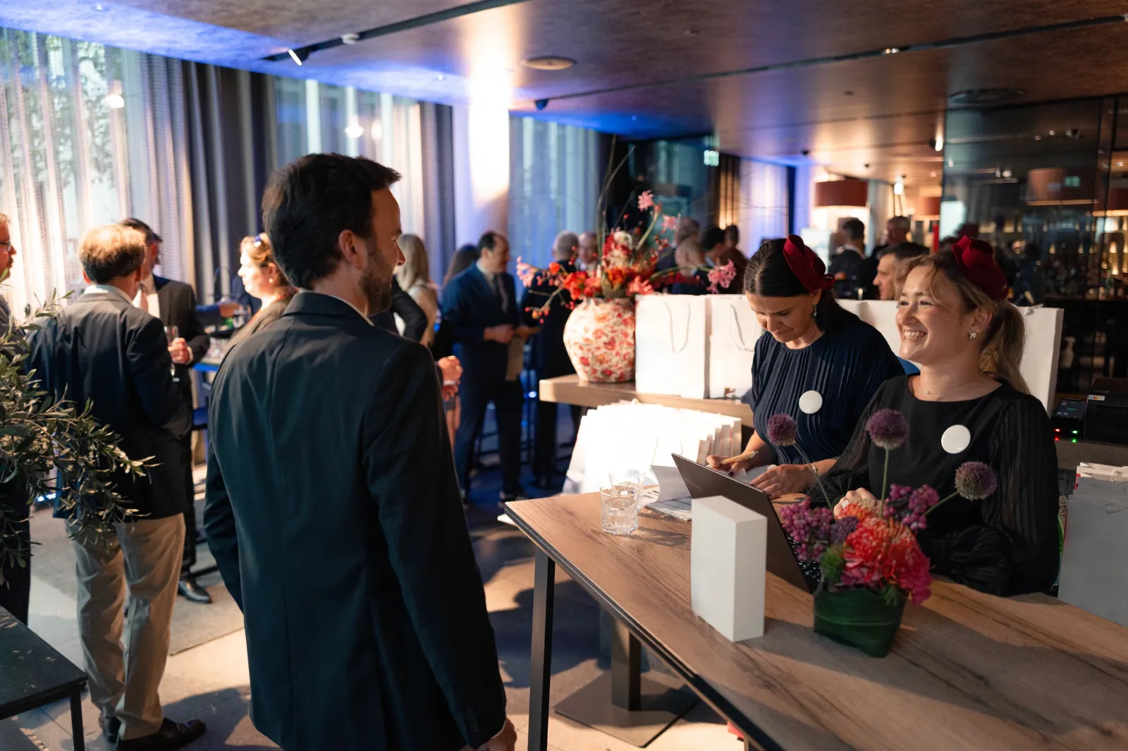 Evening gala in Frankfurt am Main, guests talking at cocktail tables