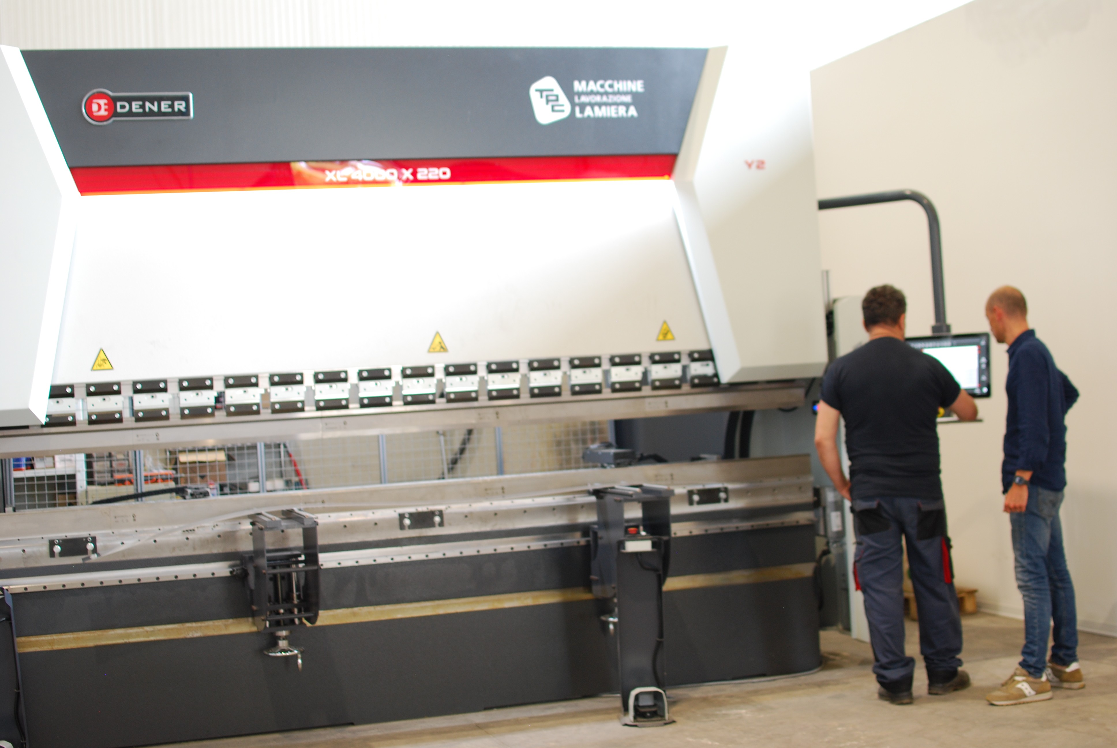 a man welding a piece of metal in the dark