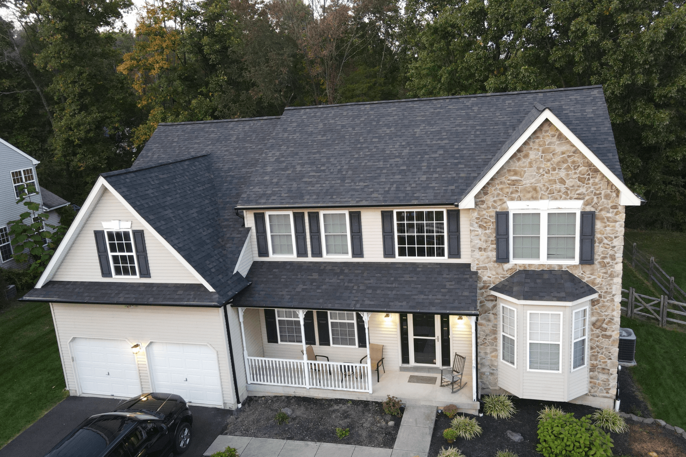 New architectural roof installed with black gutters and downspouts in Smithville, MO