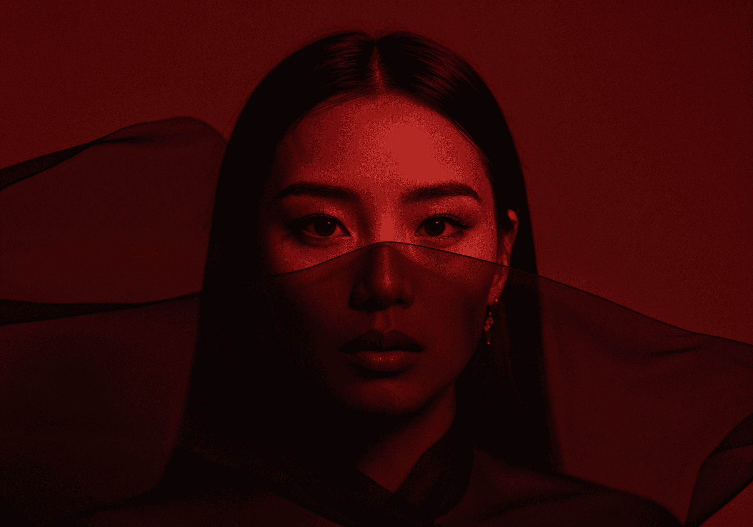 A woman with long hair standing on a beach