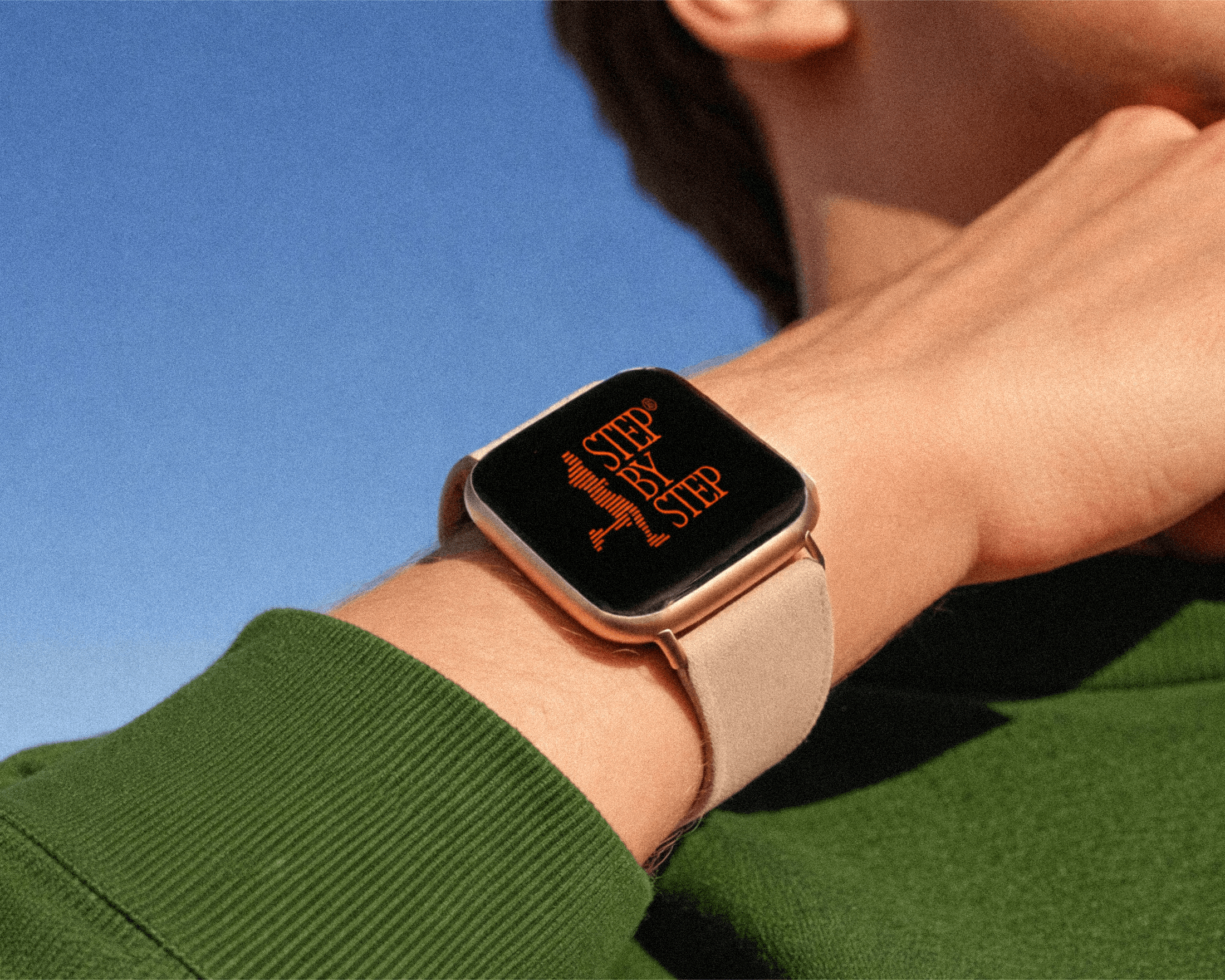 An Apple watch with the Step-by-step logo on the screen.
