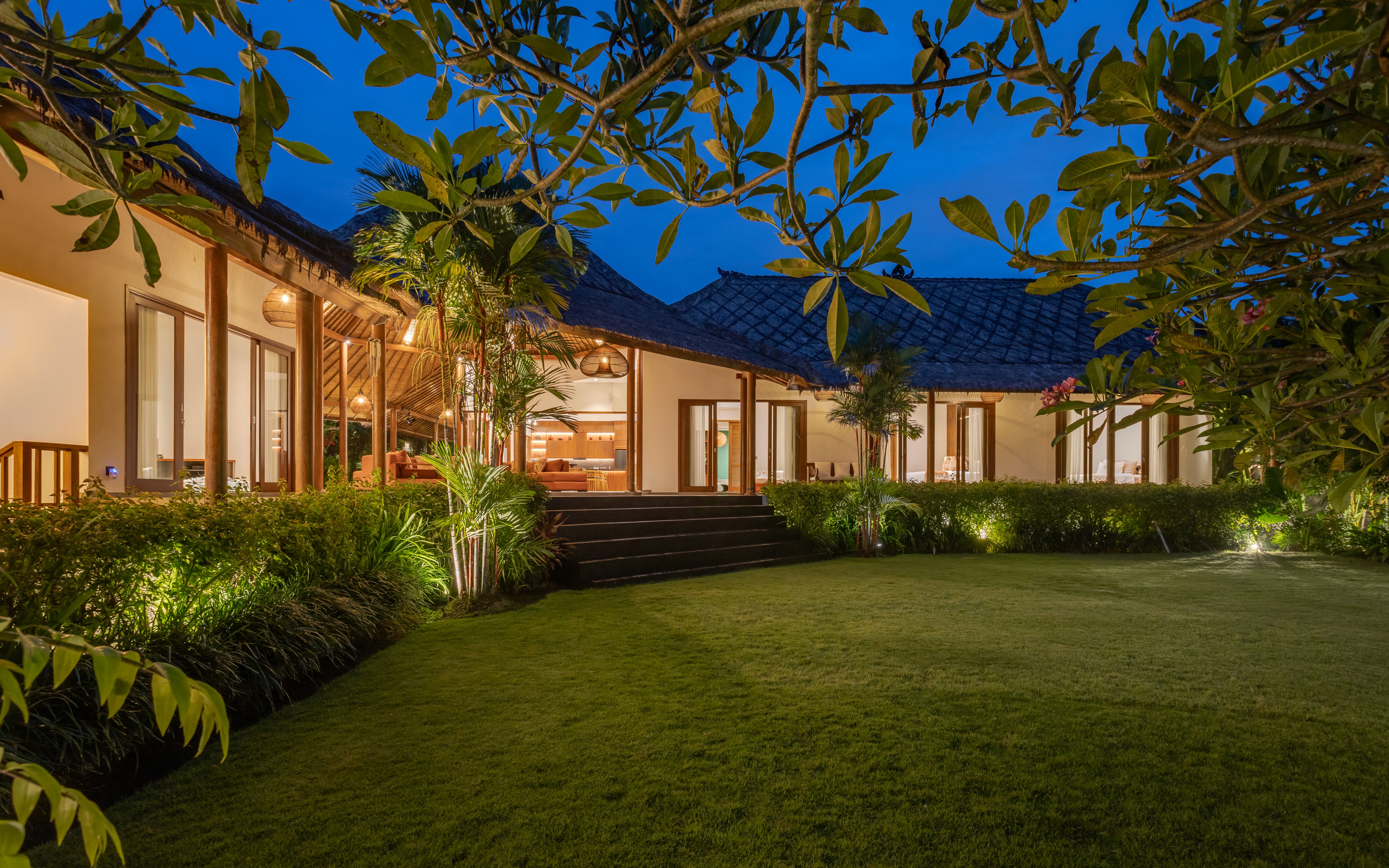 Elevated house with glass railings and scenic views