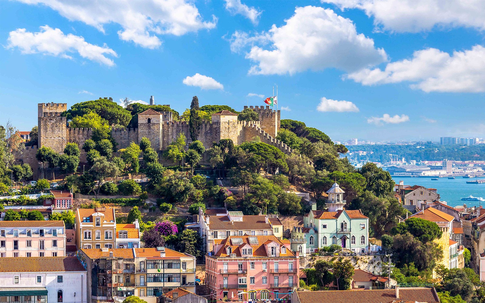 a view of a city with a large body of water in the background