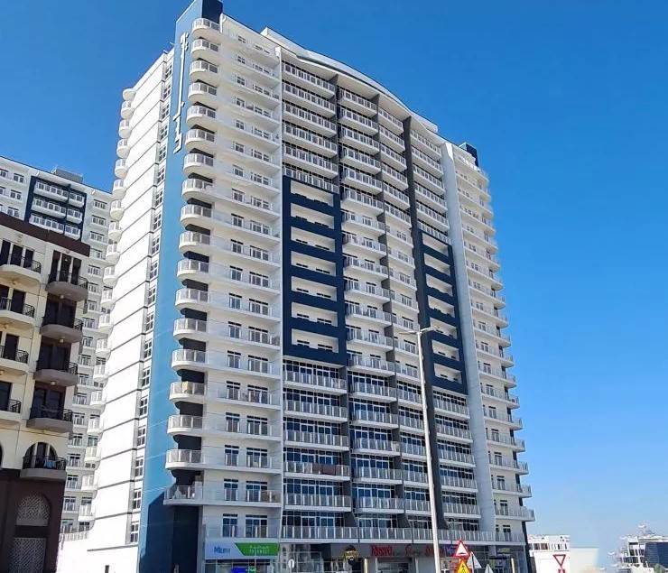 Exterior facade of Geepas Tower residential building, a top choice for real estate seekers in the UAE.