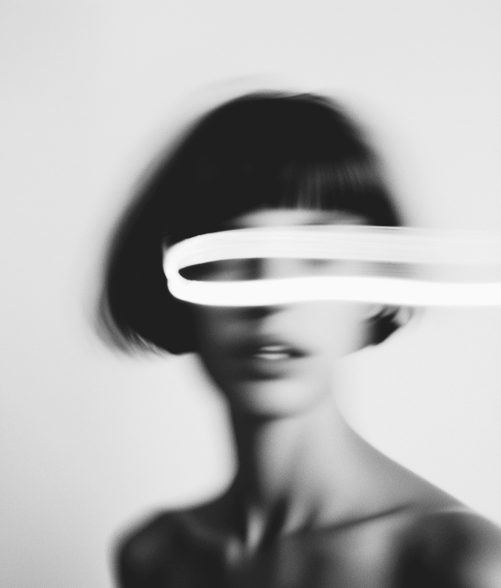 A woman with a white strip across her face with motion blur, black and white style