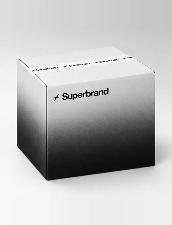 A Superbrand shipping box fading from white to black, sealed with branded tape.