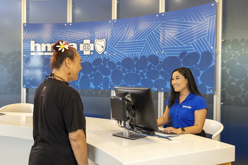 HMSA Staff greeting member in office