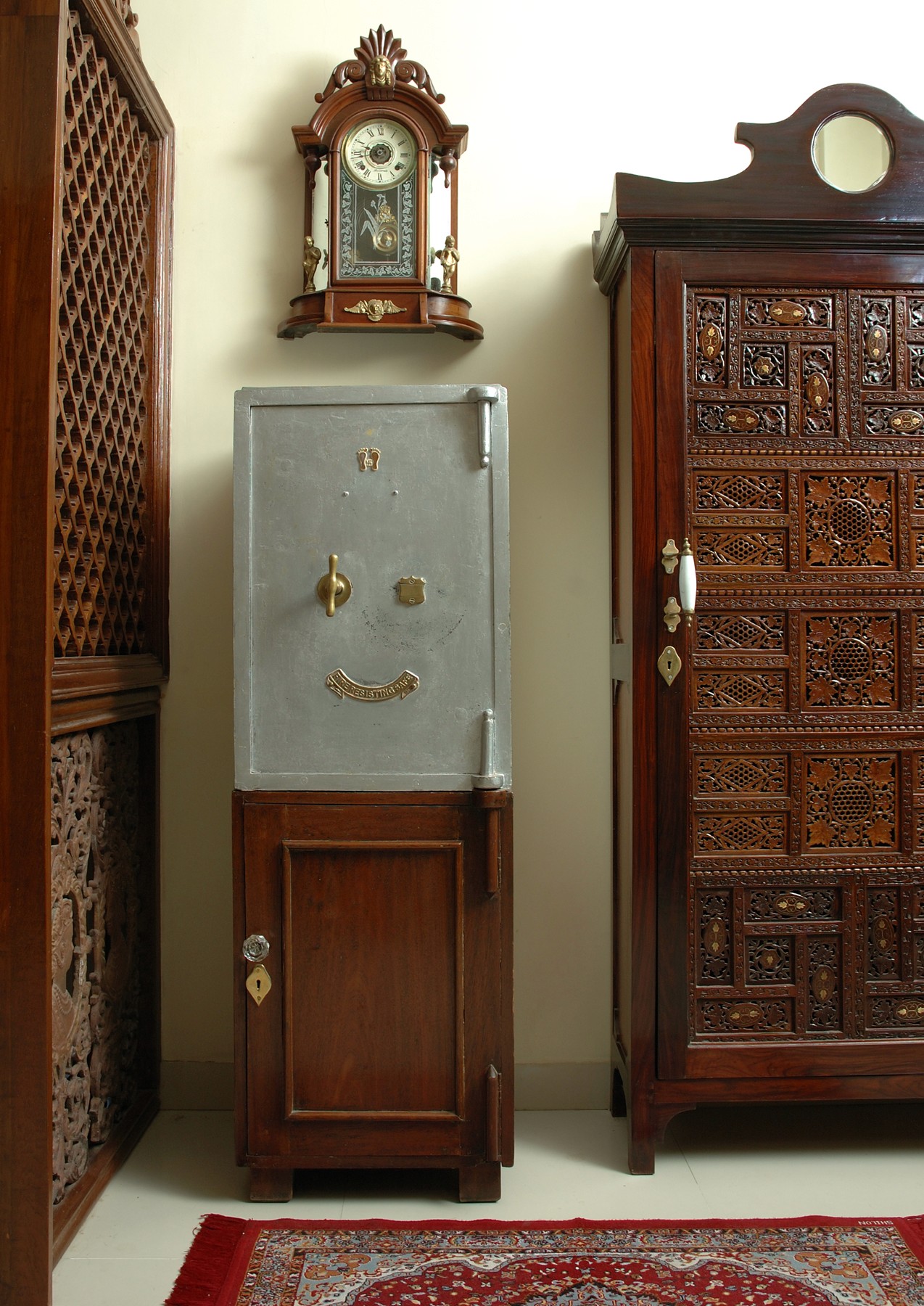 Nature-inspired preschool entrance with sculptural tree partitions and suspended green leaf ceiling panels.