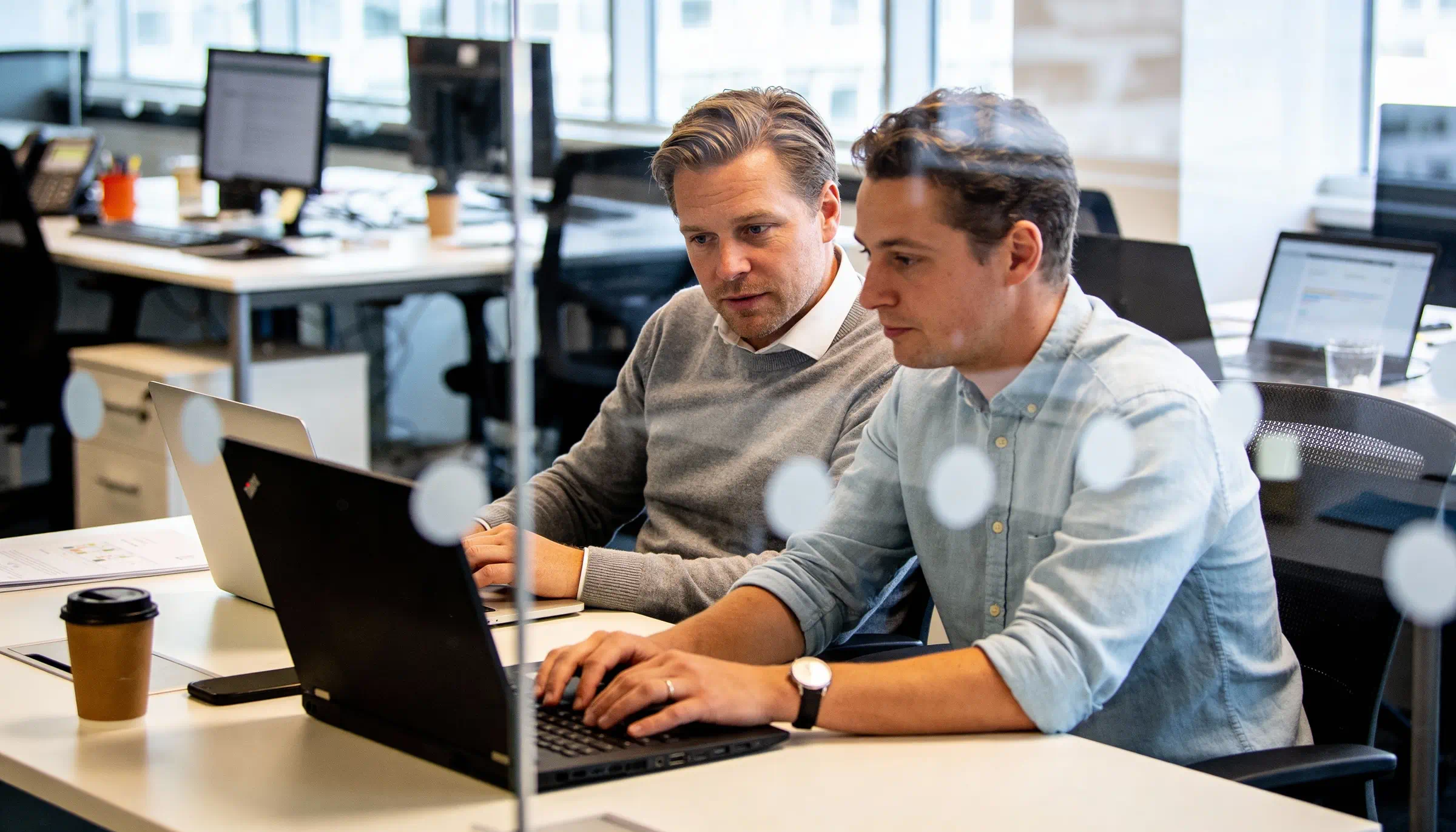 two employees talking