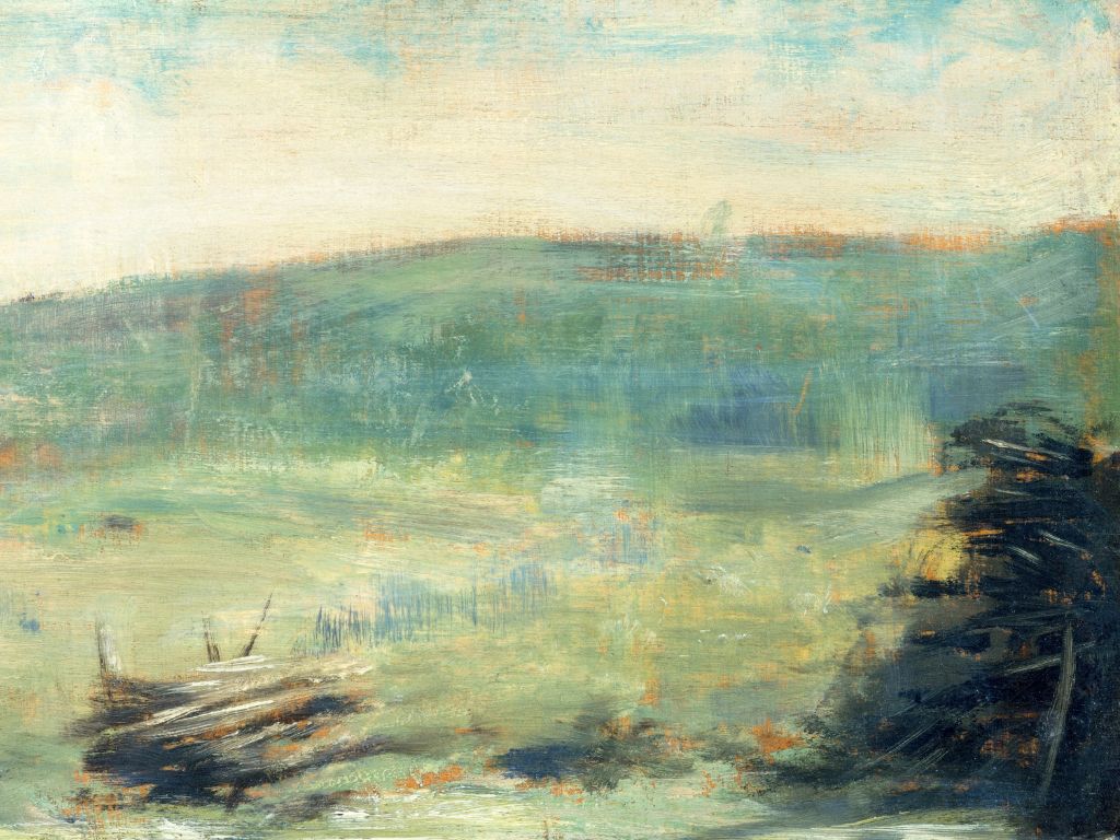 Designer wearing colourful cardigan as she colours with markers, stickers, and laptop around