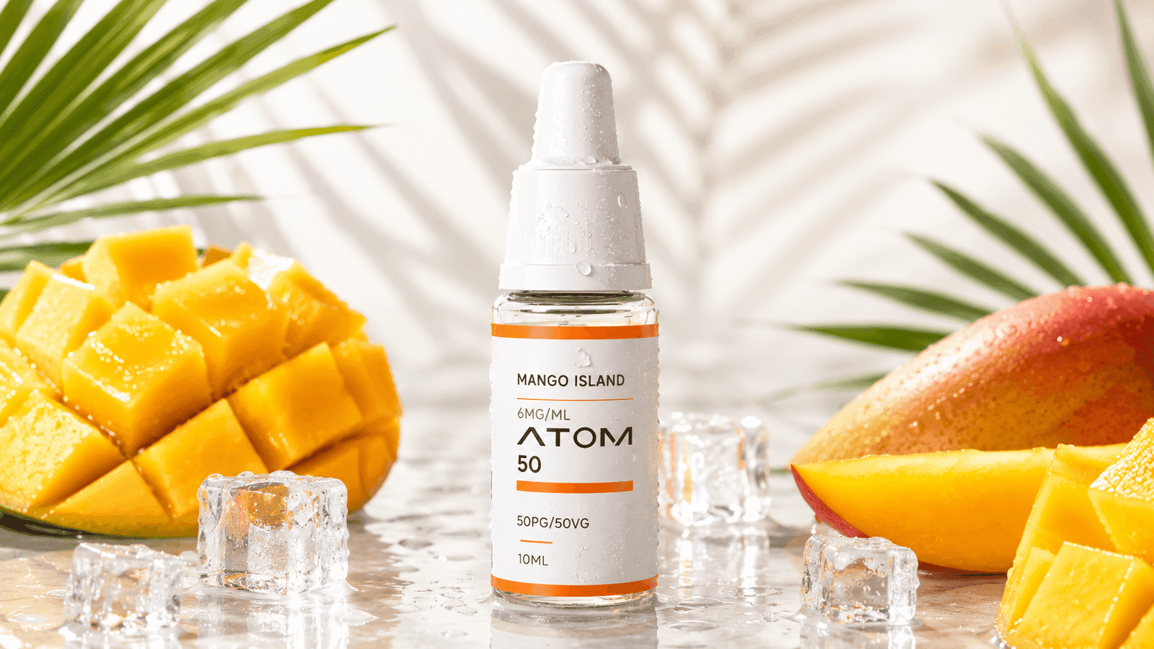 ATOM Mango Island e-liquid bottle with ripe mango pieces and ice cubes in a tropical summer e-liquid display.