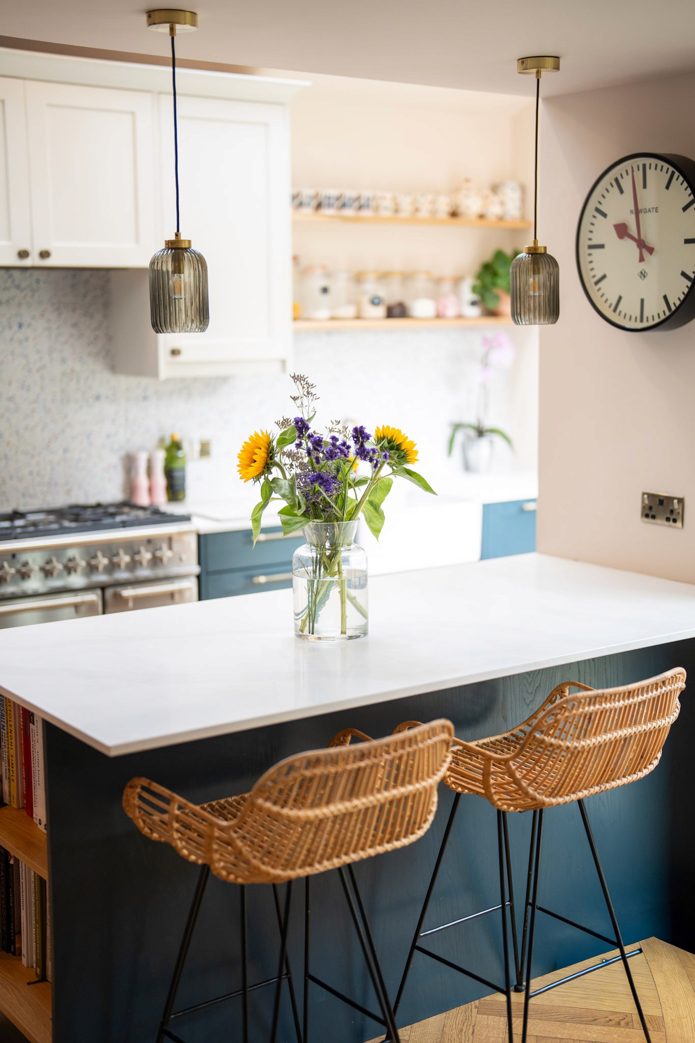 Brighton kitchen renovation featuring a large island, dark blue cabinetry, pendant lighting and bespoke open shelving