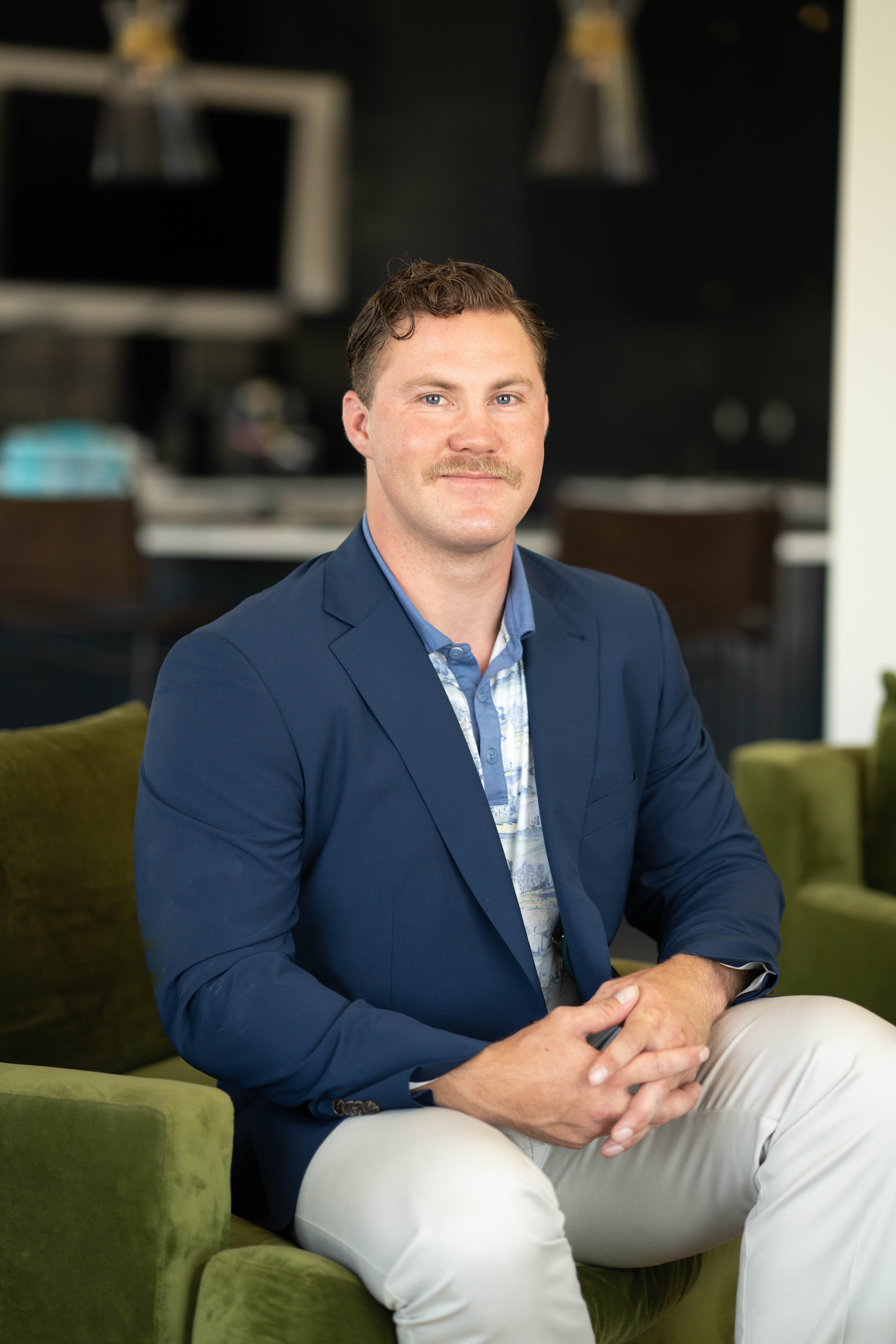 person sitting in a chair in front of a man