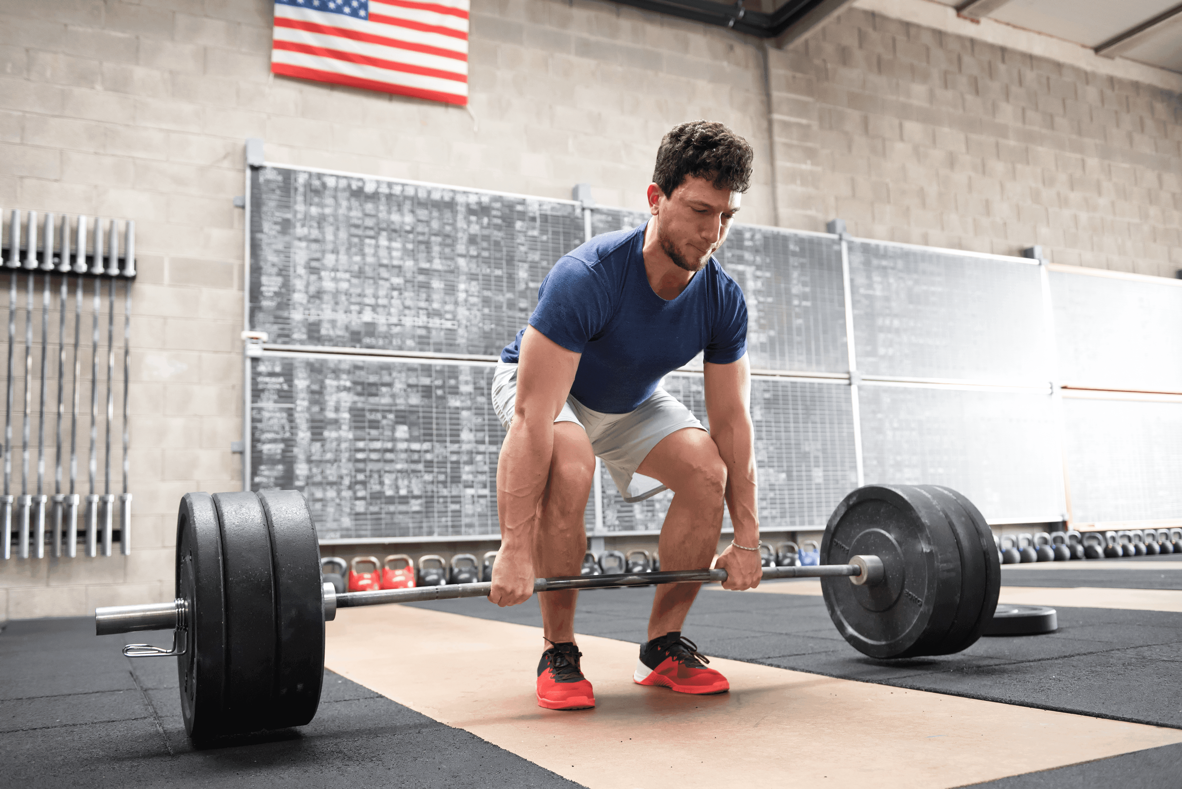 man deadlifting