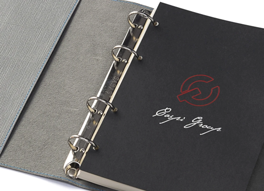 Close-up of fabric strap closure detail on ring binder journal