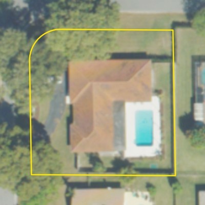 Aerial photo of a backyard pool in Fort Lauderdale, with the lot outlined in yellow