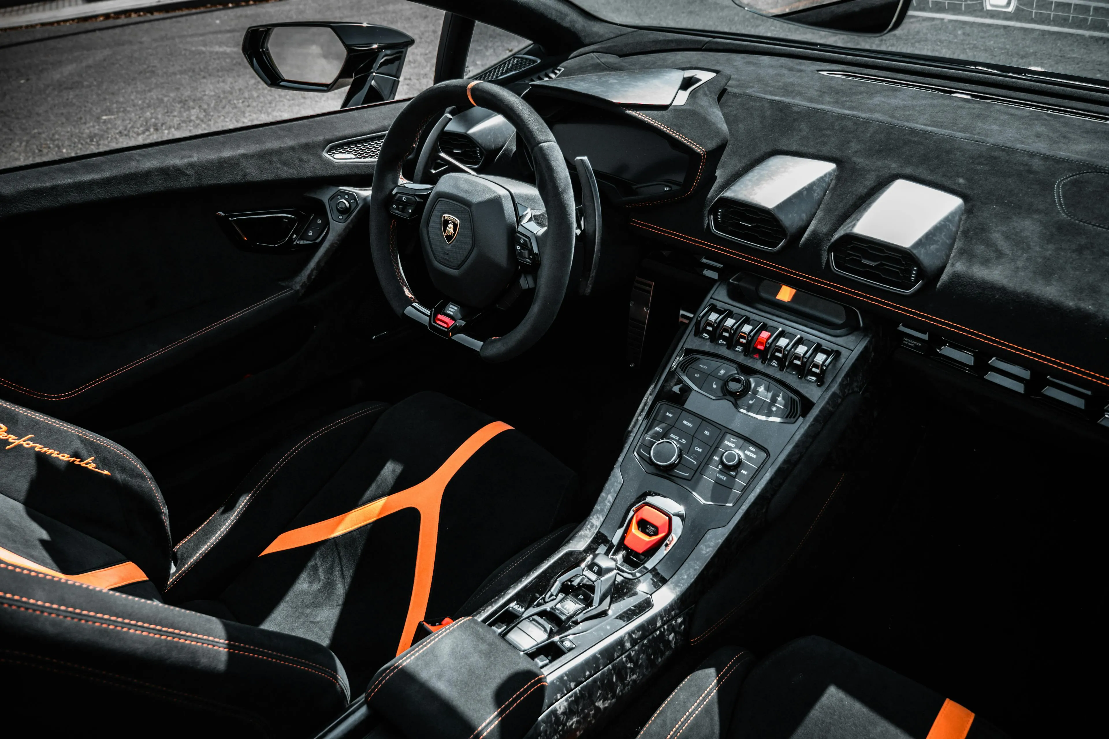 Supercar interior with orange accents