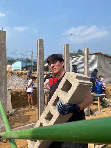 man in blue crew neck shirt wearing black framed eyeglasses