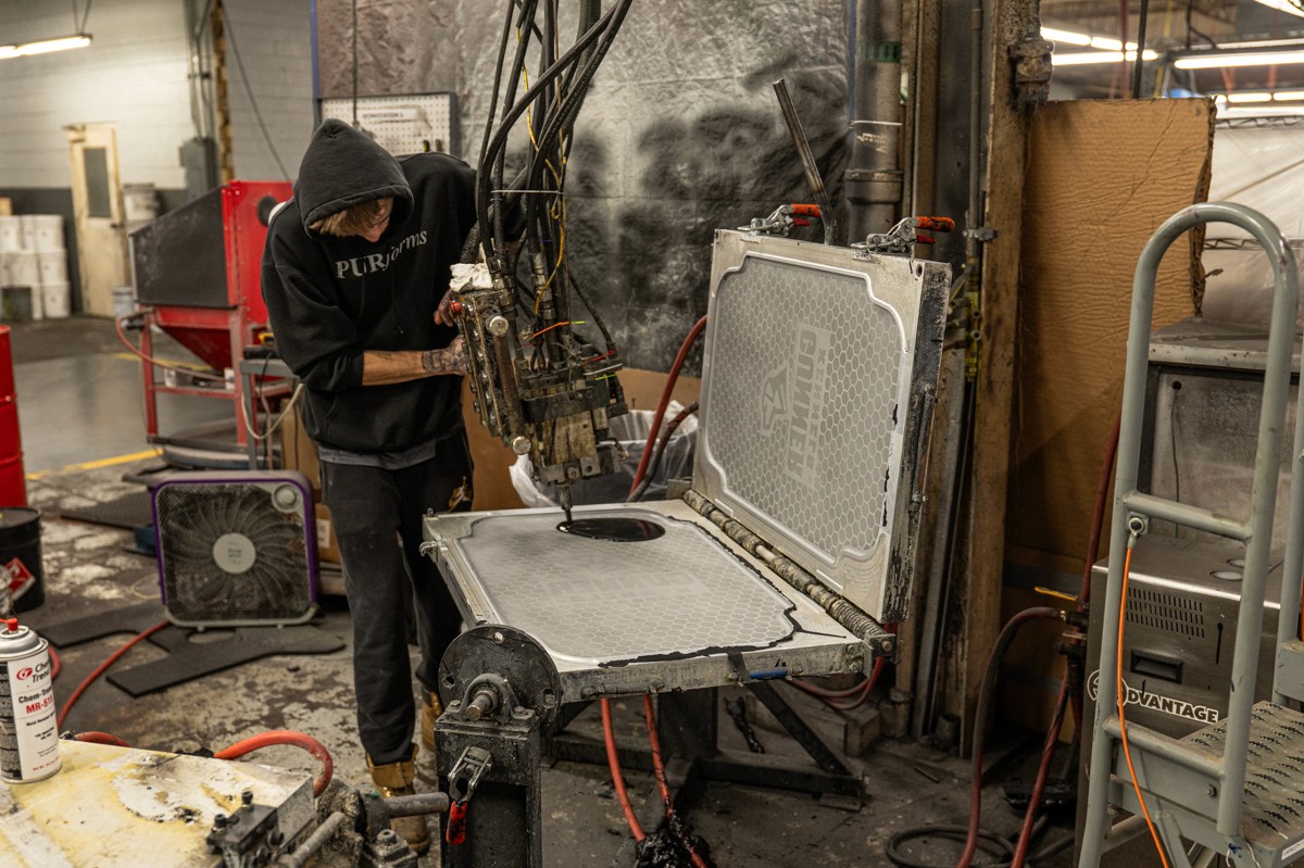 PURforms employee pouring polyurethane part