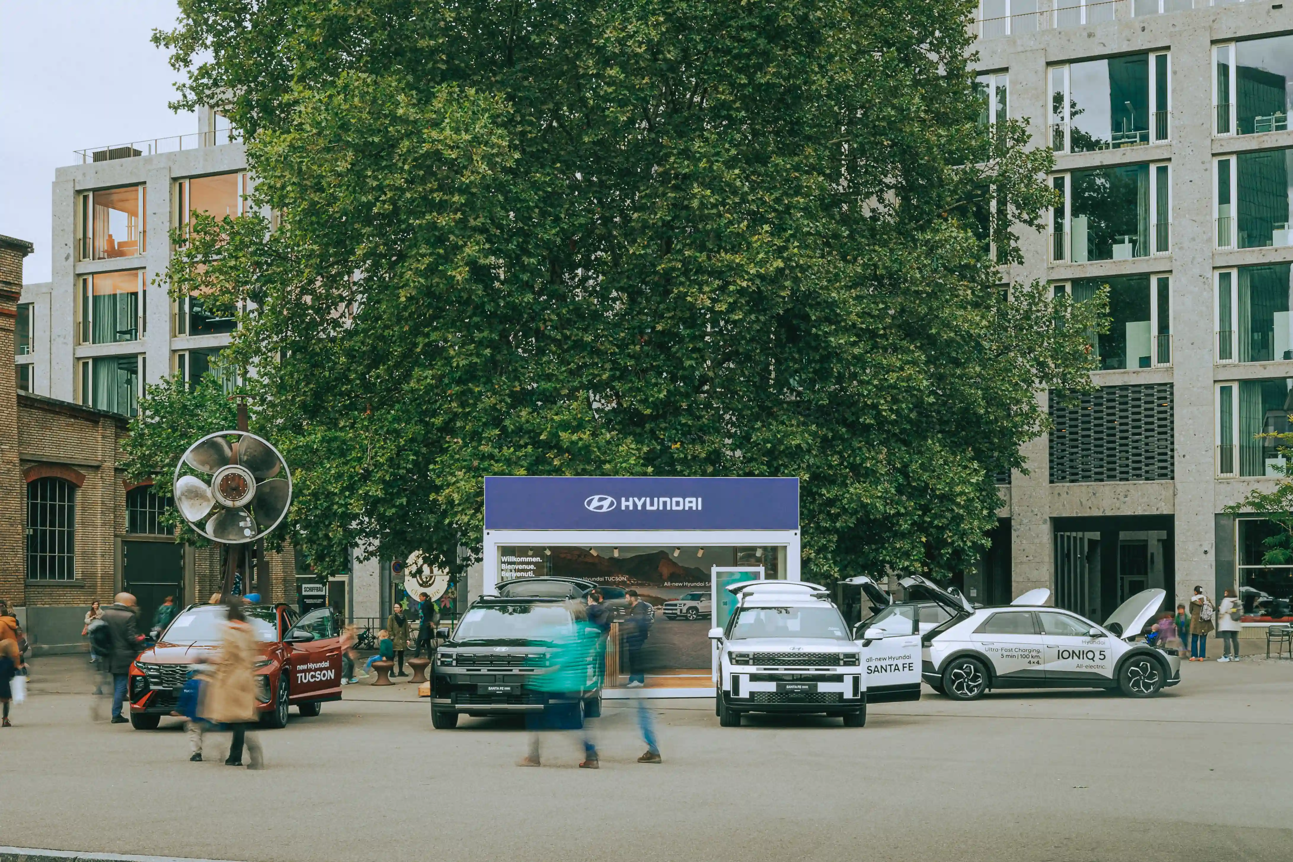 Streetside billboard with flyposters of the Batch.Works brand and illustrations