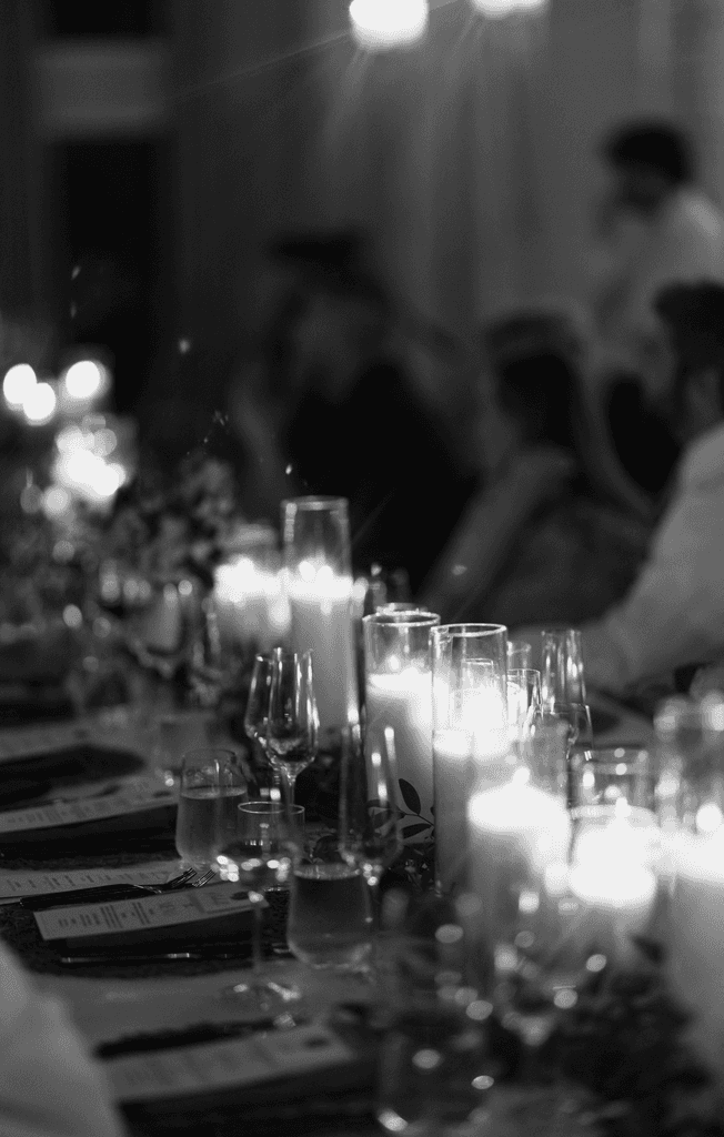     Wedding photographer in South Florida documents an intimate candlelit wedding reception in black and white.