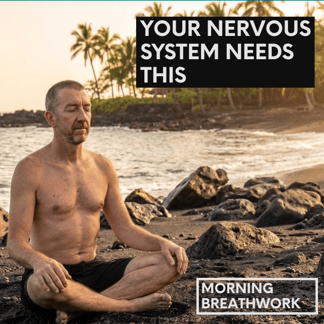 An image of Neil White on a beach, sitting cross-legged with eyes closed.